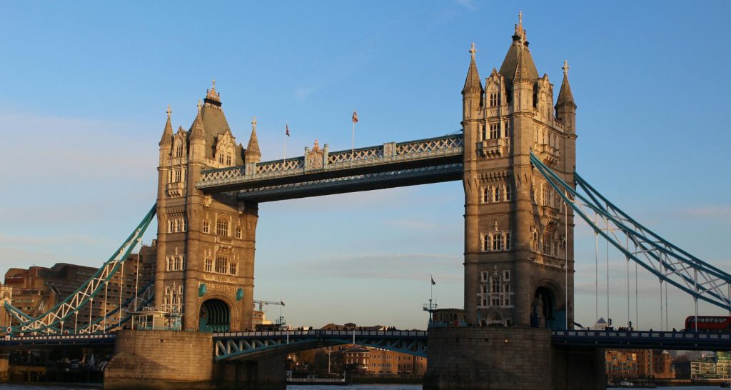 Tower Bridge in London, a landmark bascule and suspension bridge with two Gothic-style towers over the River Thames.